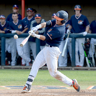 Baseball player swinging at a ball