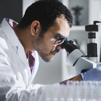 A pharmacist writing on a notepad