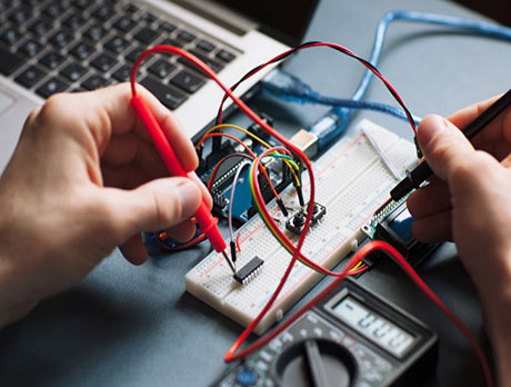 Worker tests the circuit board