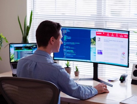 Man in an office using a computer