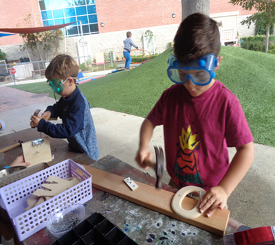 Children play with woodworking toys