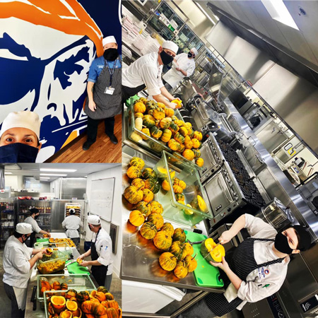 Workers prepping food in kitchen