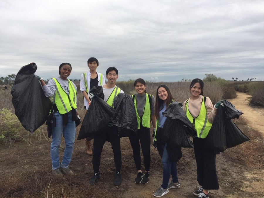 PSI Beta cleaning up a beach