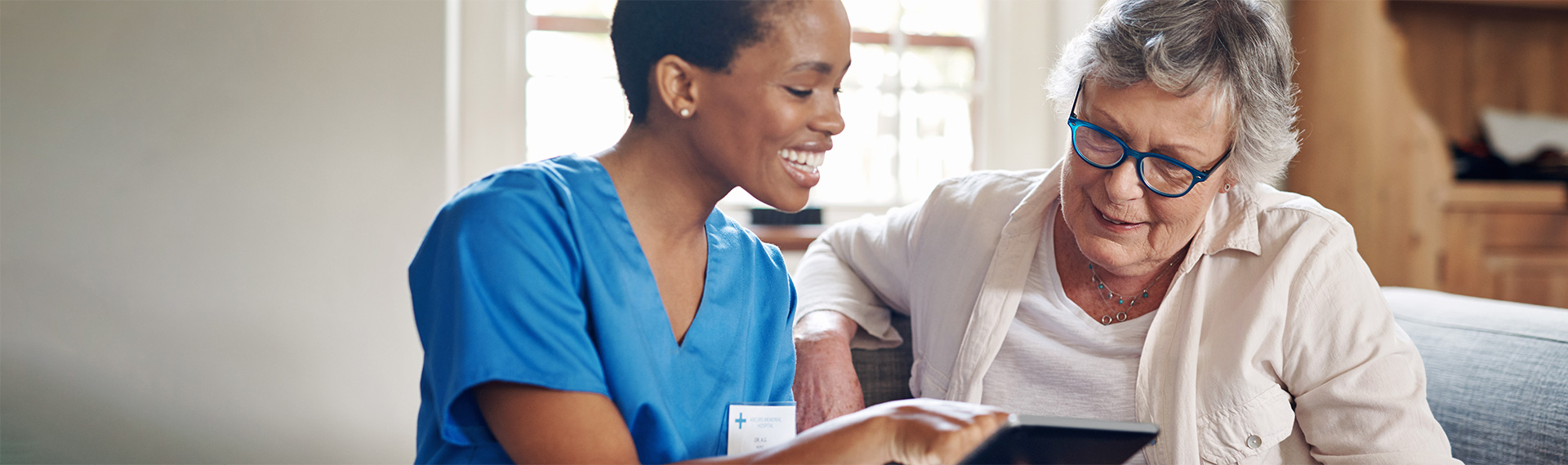 Health Coach teaching patient with a tablet device