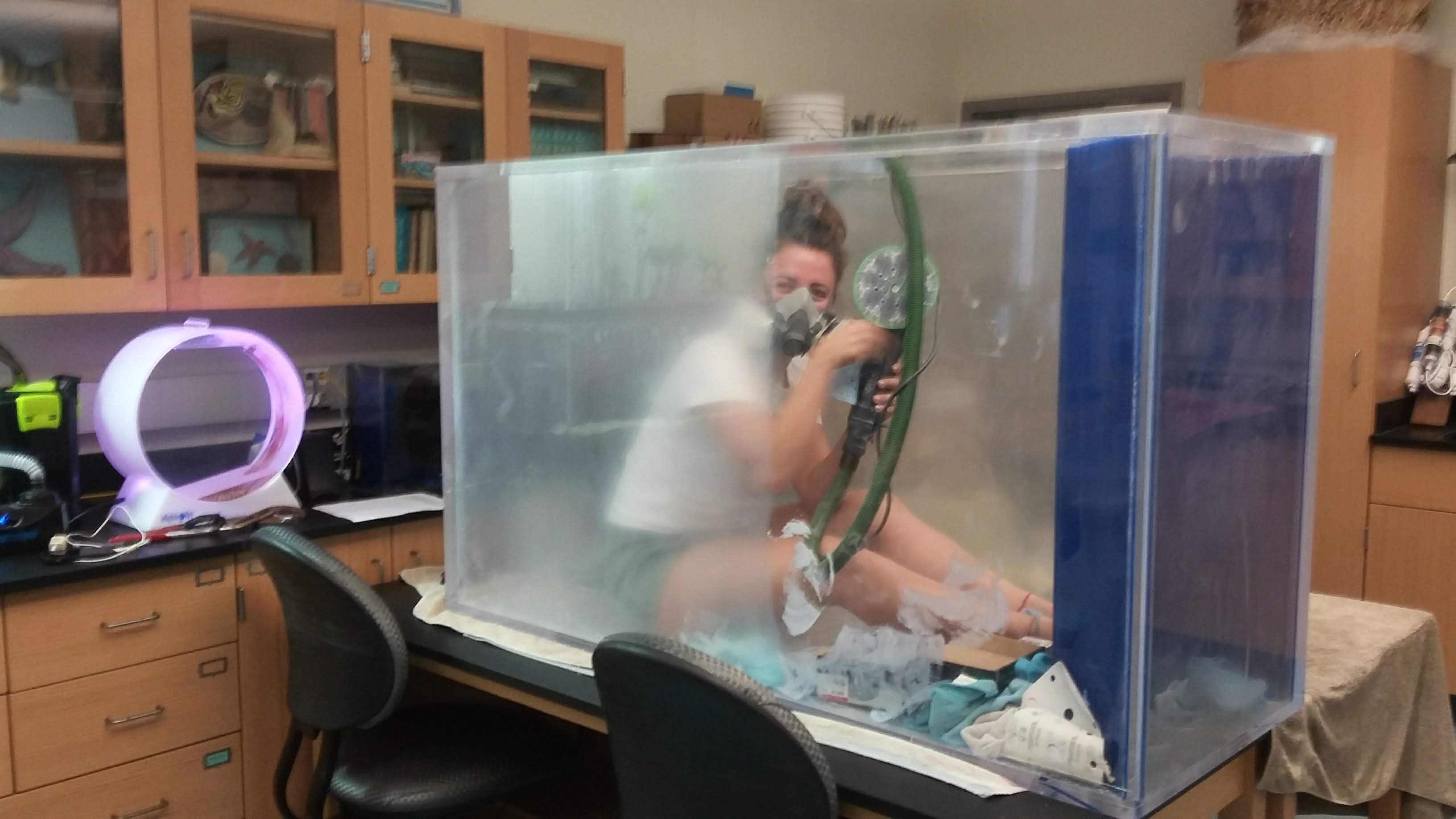 Student refinishing a donated tank