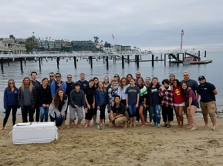 Class releasing student grown white sea bass