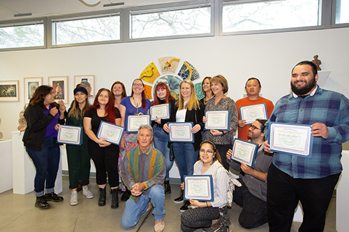 Students of Class of 2019 holding certificates