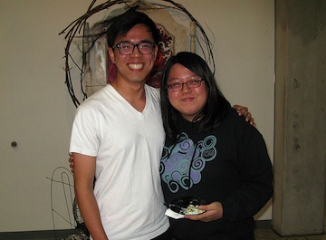 A man and woman posing for a photo