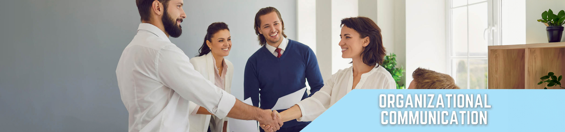 Group of people shaking hands. Text: Organizational Communication.