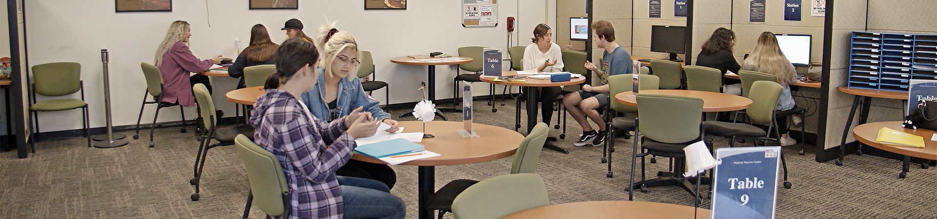 Tutors helping students in the Student Success Center