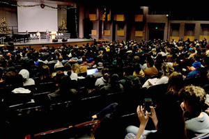 Crowd of students watching lecture by Dolores Huerta.