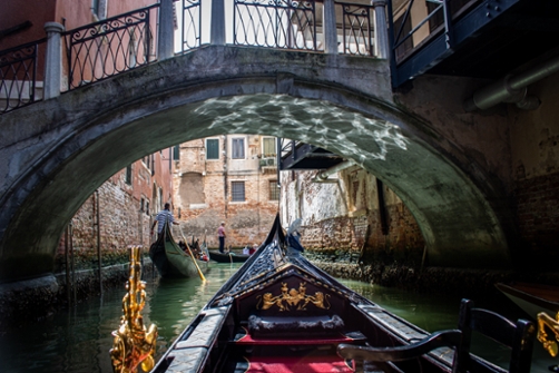 View from inside the gondola on canal in Florence